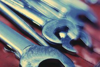 Use two wrenches to tighten a compression fitting.